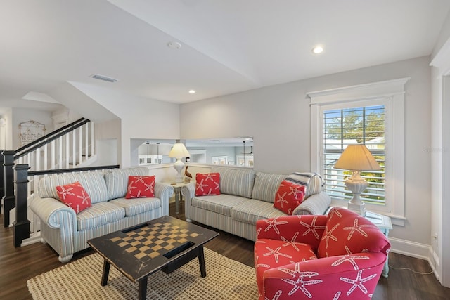 living area with stairs, wood finished floors, visible vents, and recessed lighting