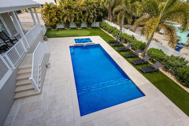 view of swimming pool with a patio area, a fenced backyard, and a fenced in pool