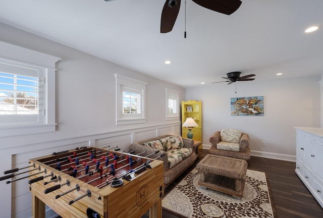 game room featuring a ceiling fan, baseboards, dark wood-type flooring, and recessed lighting