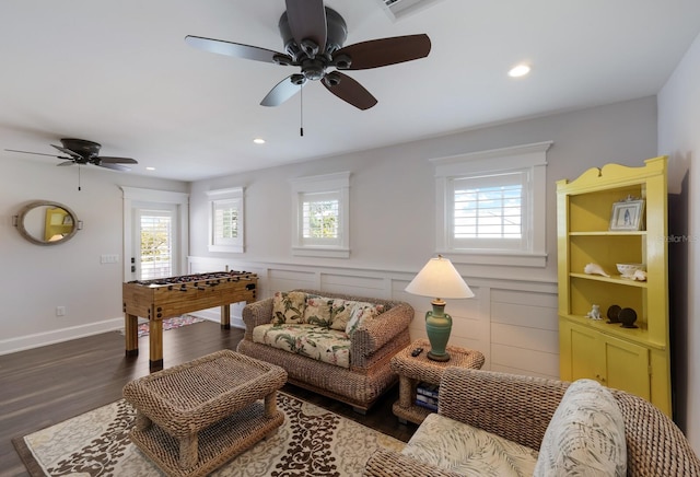 interior space featuring a healthy amount of sunlight, a wainscoted wall, wood finished floors, and recessed lighting