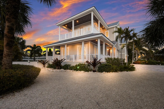 exterior space featuring a porch and a balcony