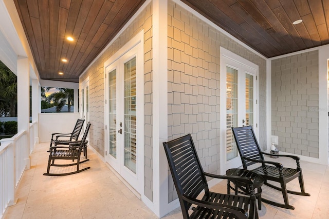 view of patio / terrace featuring french doors and a porch