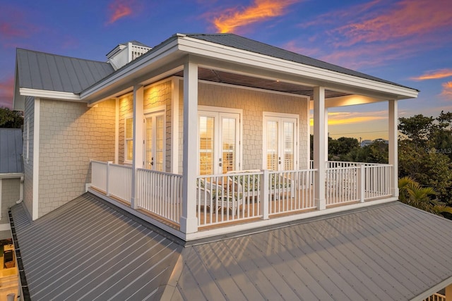 wooden deck featuring french doors