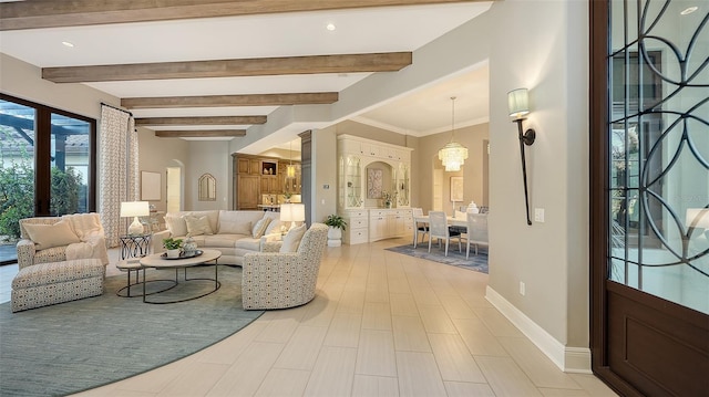 interior space featuring baseboards, a notable chandelier, beam ceiling, and crown molding