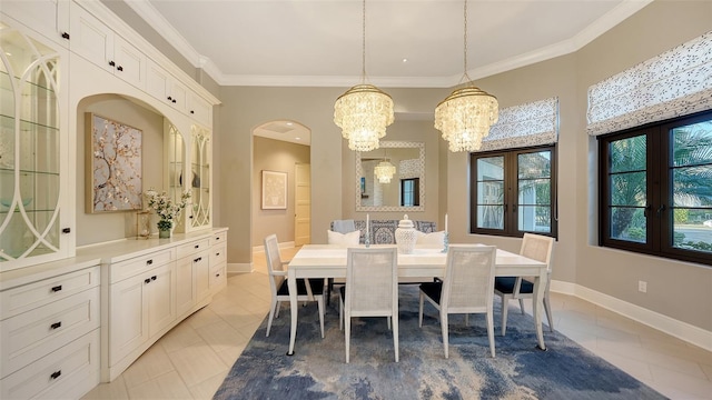 dining space with baseboards, light tile patterned flooring, and crown molding