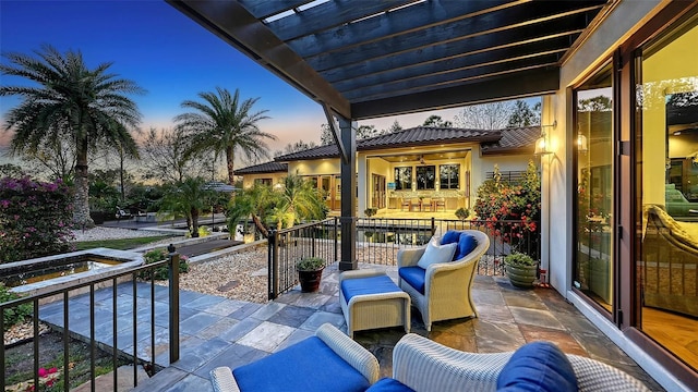 patio terrace at dusk with a balcony