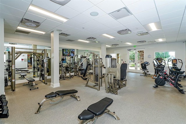 workout area with visible vents and a drop ceiling