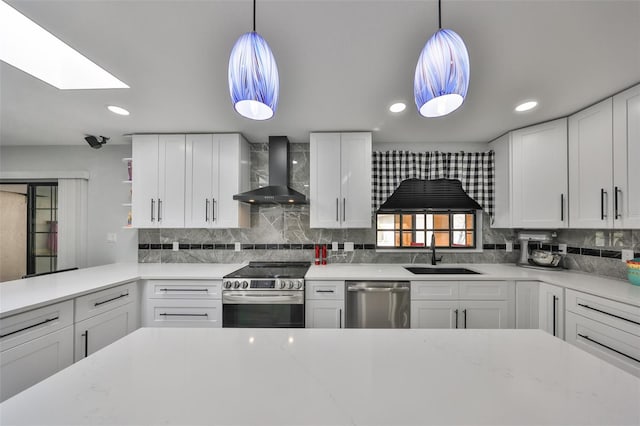 kitchen with white cabinets, wall chimney exhaust hood, stainless steel appliances, open shelves, and a sink