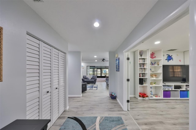 hallway featuring visible vents, baseboards, wood finished floors, and recessed lighting