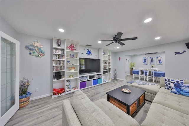 living area featuring recessed lighting, ceiling fan, baseboards, and wood finished floors