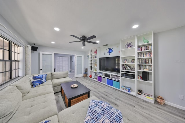 living area with baseboards, ceiling fan, wood finished floors, and recessed lighting