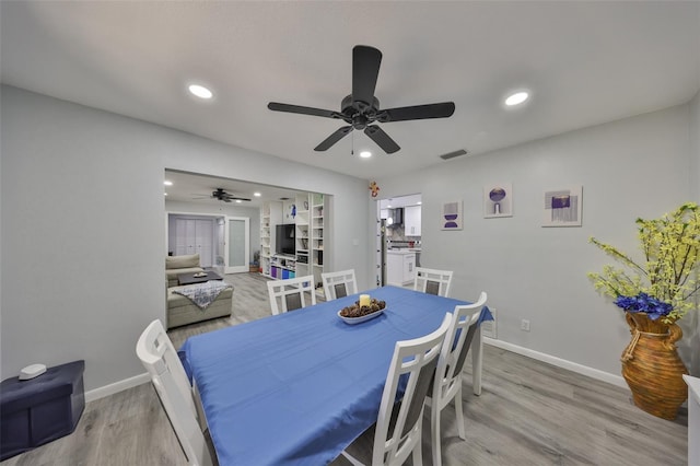 dining area with recessed lighting, light wood-type flooring, visible vents, and baseboards