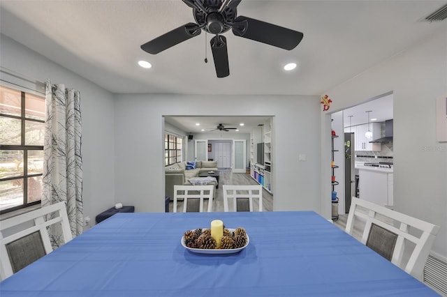 dining room featuring visible vents and recessed lighting