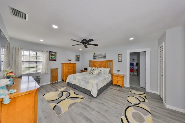 bedroom with light wood-type flooring, baseboards, visible vents, and recessed lighting