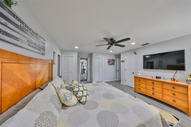 bedroom with ceiling fan, recessed lighting, visible vents, baseboards, and light wood finished floors