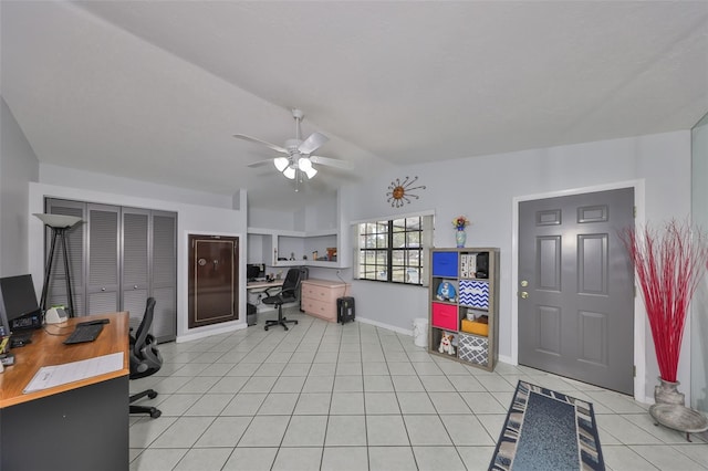 home office with light tile patterned floors, baseboards, vaulted ceiling, and a ceiling fan