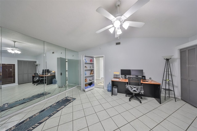 office with lofted ceiling, tile patterned flooring, visible vents, and a ceiling fan