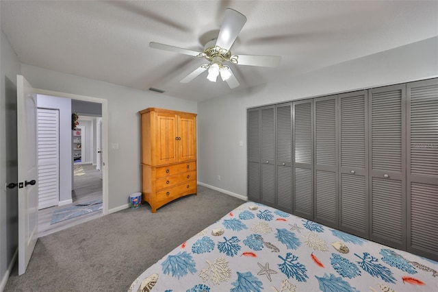 bedroom with carpet, a closet, visible vents, and baseboards