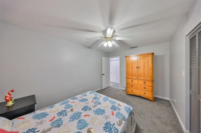 bedroom featuring ceiling fan, carpet flooring, visible vents, baseboards, and a closet