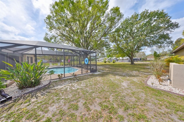 view of yard with a lanai and an outdoor pool