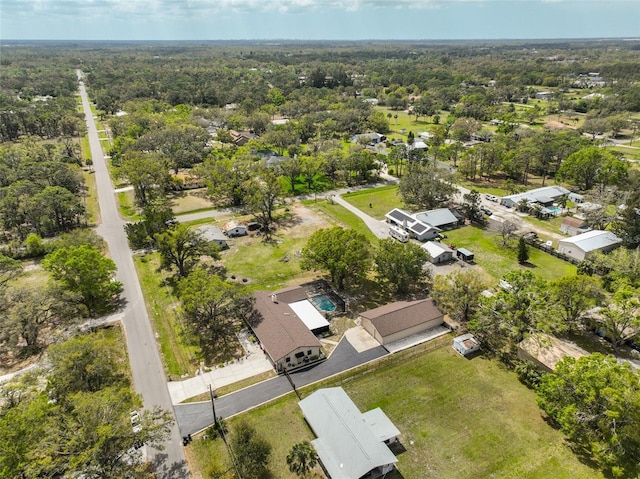 drone / aerial view featuring a view of trees