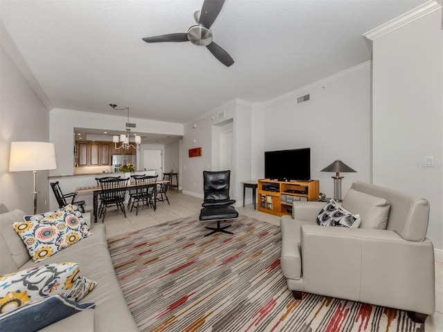 living area with light tile patterned floors, baseboards, visible vents, crown molding, and ceiling fan with notable chandelier