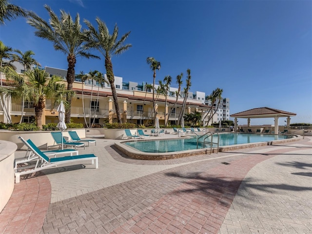 community pool featuring a patio area and a gazebo