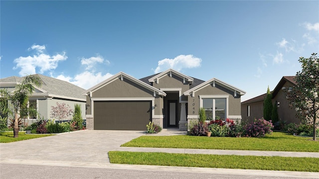 craftsman house with an attached garage, driveway, a front lawn, and stucco siding