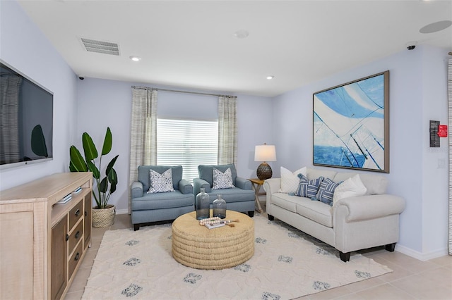 living room featuring recessed lighting, visible vents, baseboards, and light tile patterned flooring