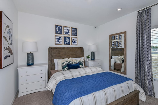 carpeted bedroom with baseboards