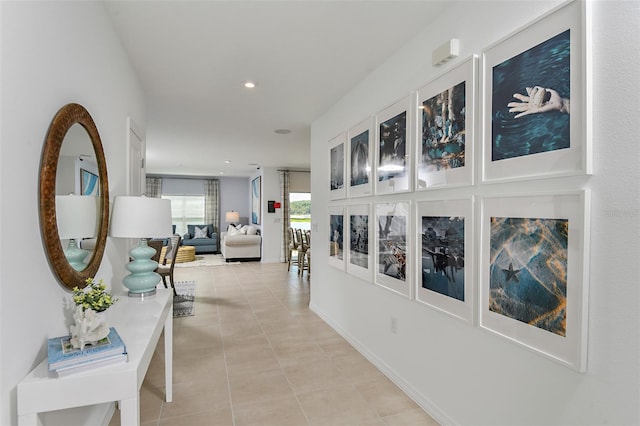 hallway featuring recessed lighting and light tile patterned floors