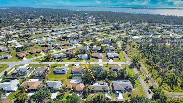 birds eye view of property featuring a water view and a residential view