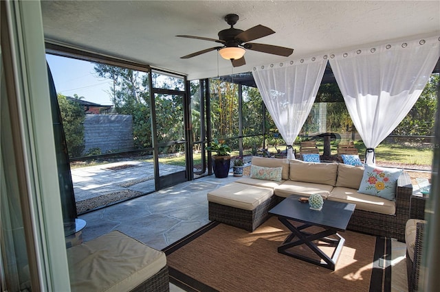 sunroom with ceiling fan and a wealth of natural light