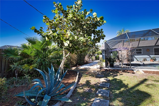 view of yard with a patio and a lanai