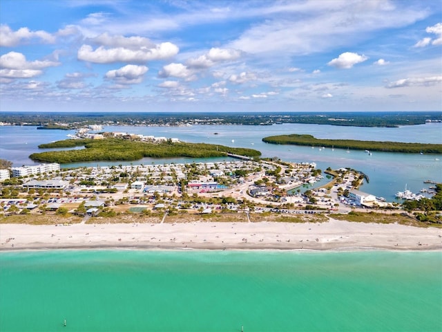 bird's eye view featuring a view of the beach and a water view