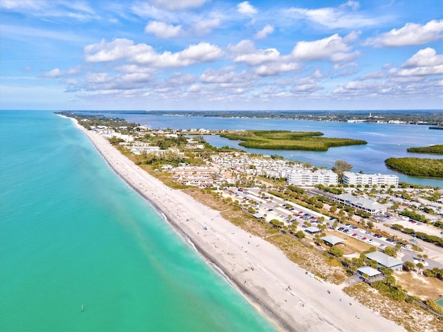 aerial view featuring a water view and a beach view