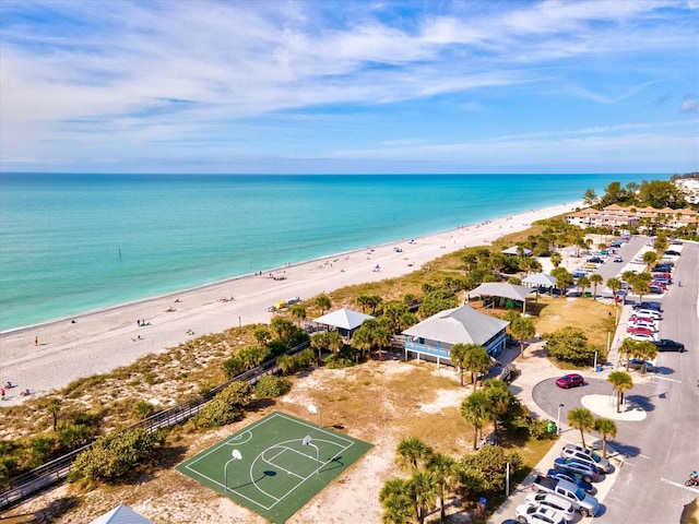 bird's eye view featuring a water view and a view of the beach