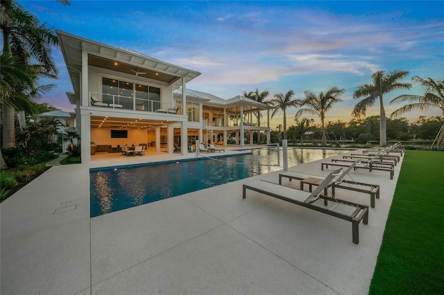 pool featuring a patio and a ceiling fan