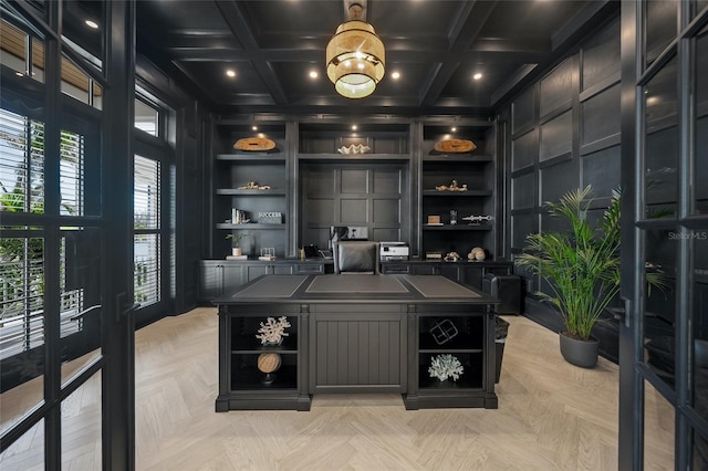 office featuring coffered ceiling, built in features, a decorative wall, and beam ceiling