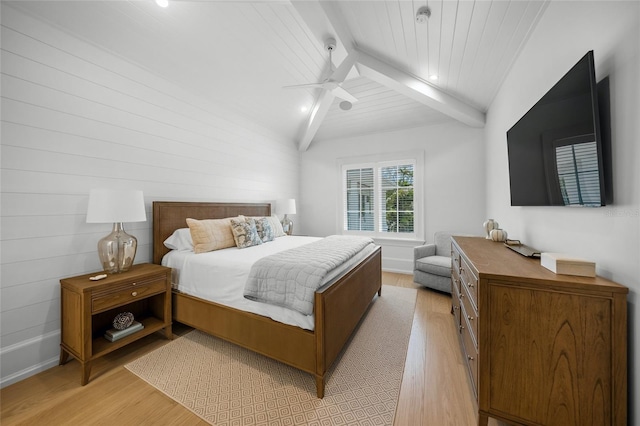 bedroom with vaulted ceiling with beams, light wood finished floors, and wood ceiling