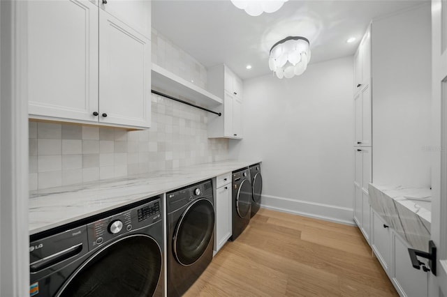 laundry room with recessed lighting, cabinet space, light wood-style floors, independent washer and dryer, and baseboards