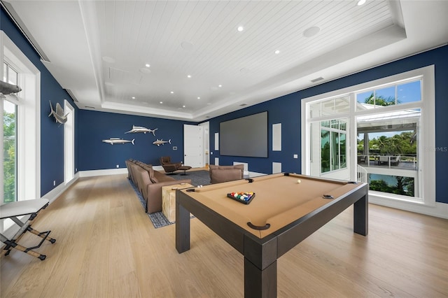 rec room featuring a tray ceiling, wooden ceiling, baseboards, and light wood finished floors