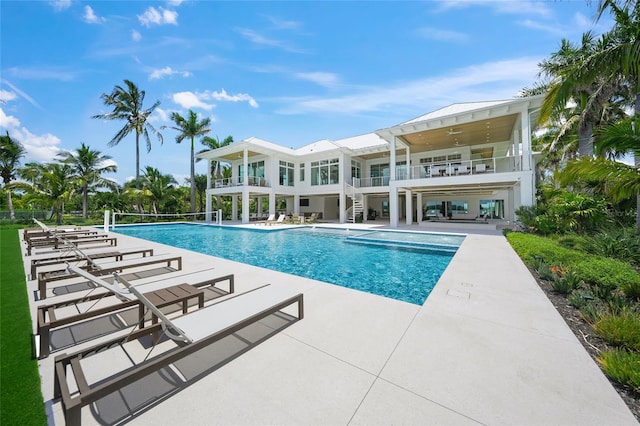 outdoor pool featuring a patio and ceiling fan