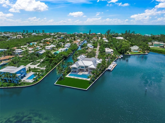 birds eye view of property featuring a water view