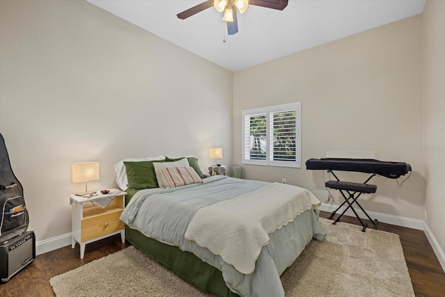 bedroom featuring a ceiling fan, dark wood finished floors, and baseboards