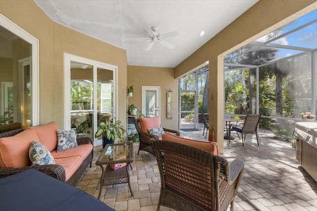 sunroom with a ceiling fan