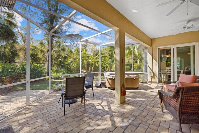 sunroom / solarium with a ceiling fan