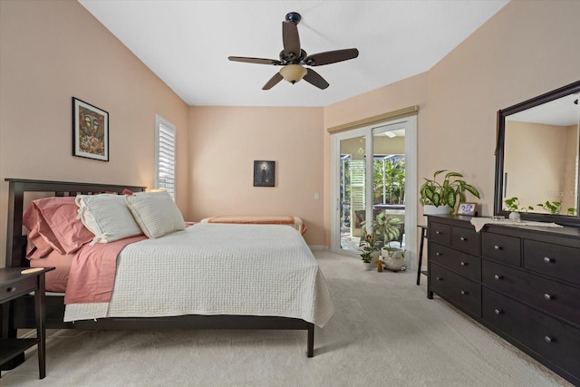 bedroom with a ceiling fan, access to outside, multiple windows, and light carpet