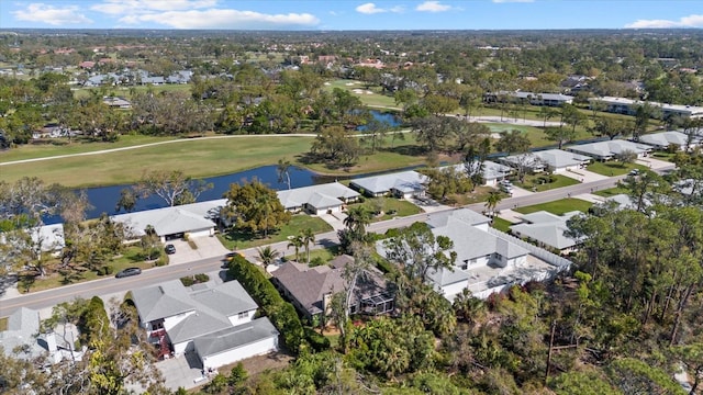 aerial view featuring a residential view, view of golf course, and a water view