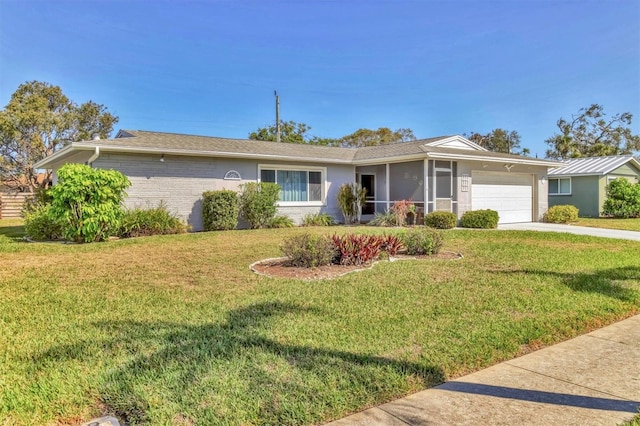 single story home with brick siding, a front yard, a sunroom, a garage, and driveway